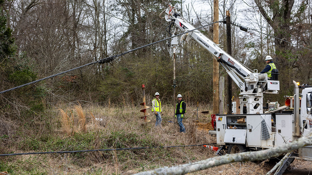 Crews work to restore power near Cemetary Road and Wallace Drive in Edwards, Mississippi.